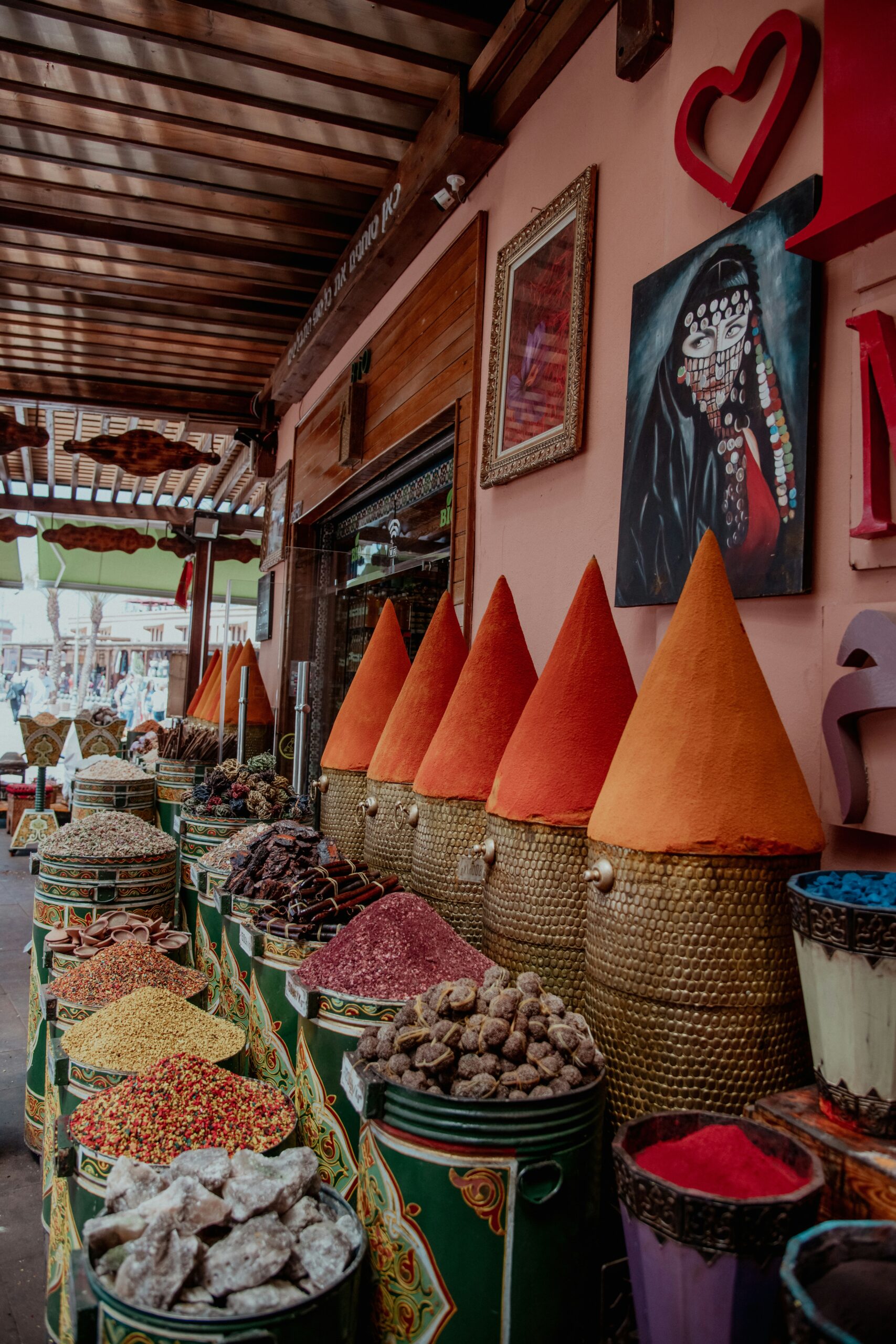 what is aker fassi — pomegranate rind and poppy petals at a traditional spice stall in Fez souq